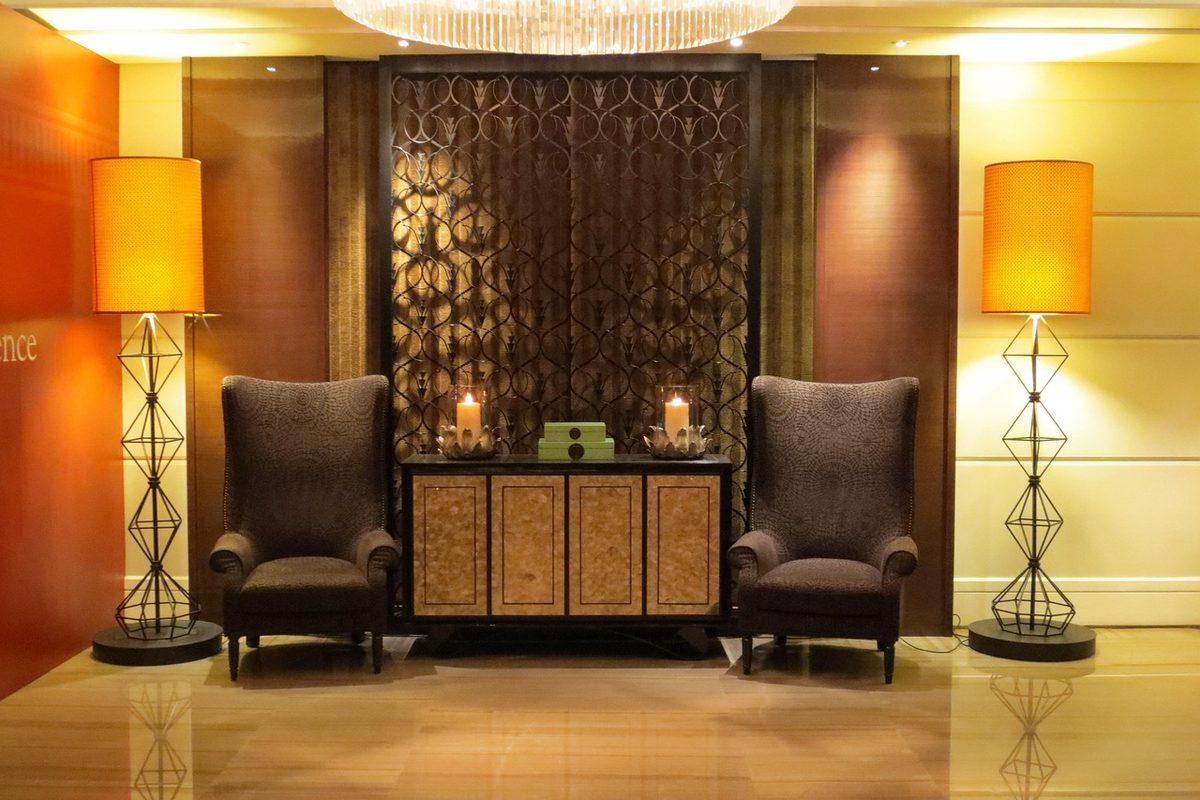 Low-lit VIP lounge with plush seating styled for an exclusive hosted evening